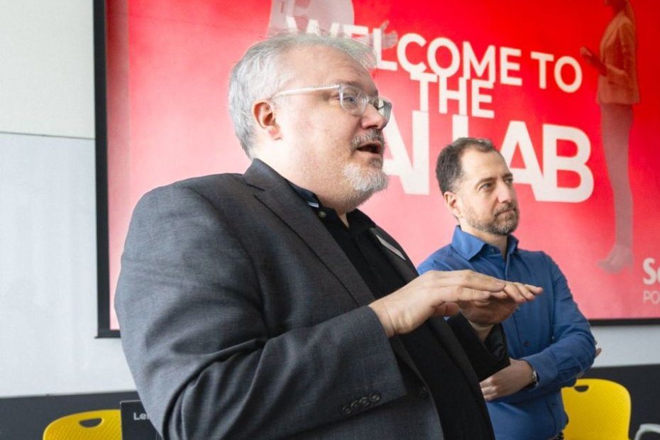 Kent Peel speaking and Panos Panagiotakopoulos listening in the Seneca AI Lab